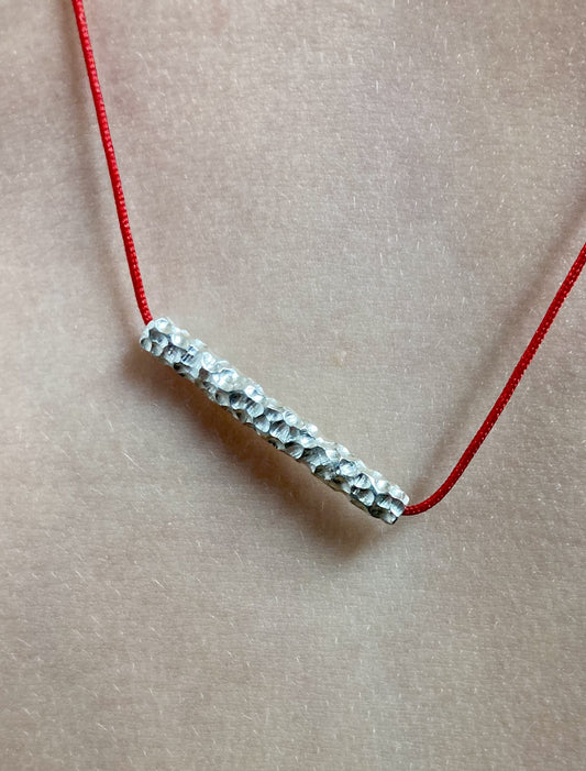 Textured Carved Silver Pendant – Red Cord