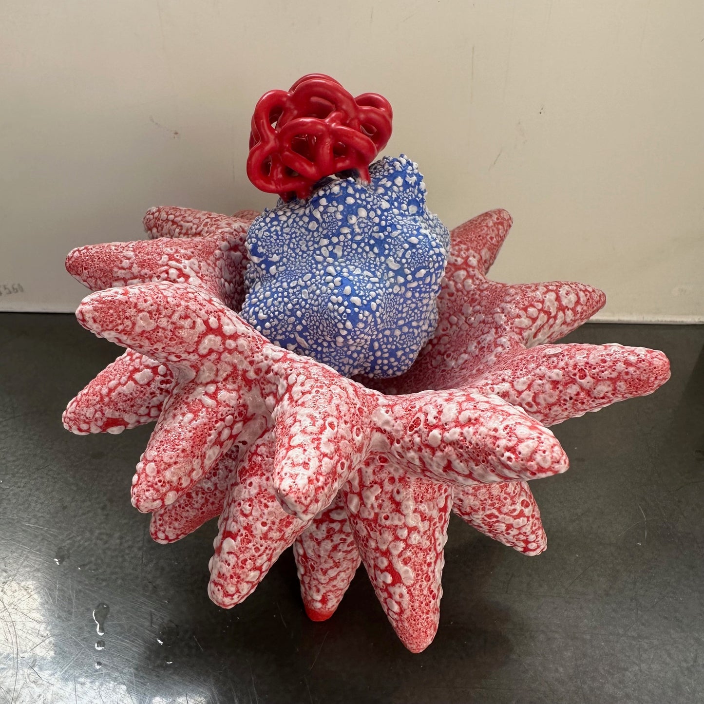 Miniature Blue Cloud Bundle in Red Pollinating Creature